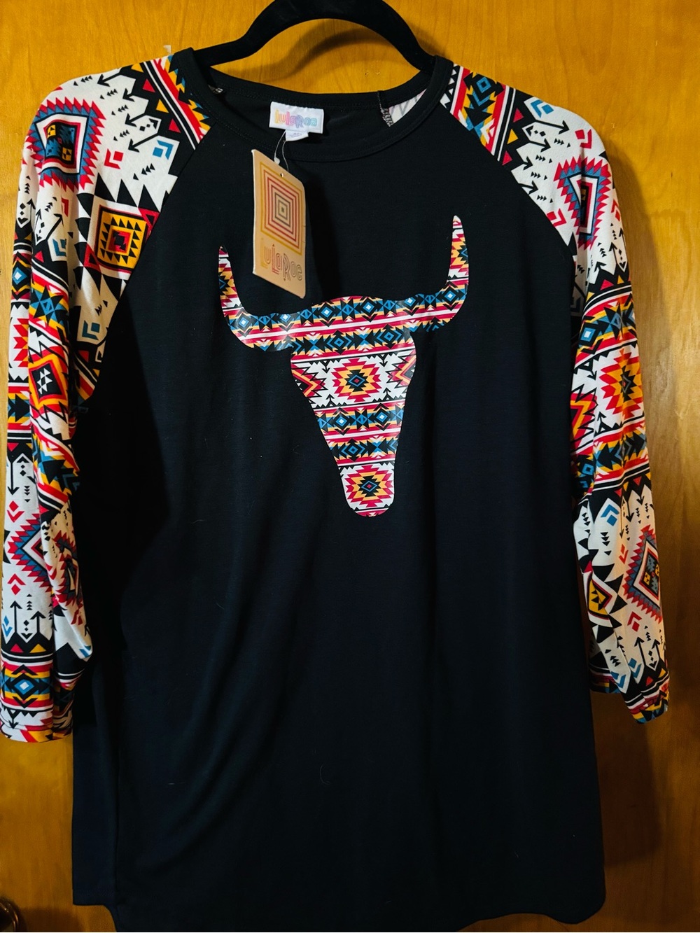LuLaRoe Black Raglan Tee with Multicolor Aztec Bull Graphic
